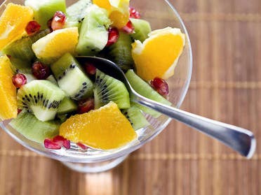 A fruit salad in a bowl is displayed. (Stock photo)