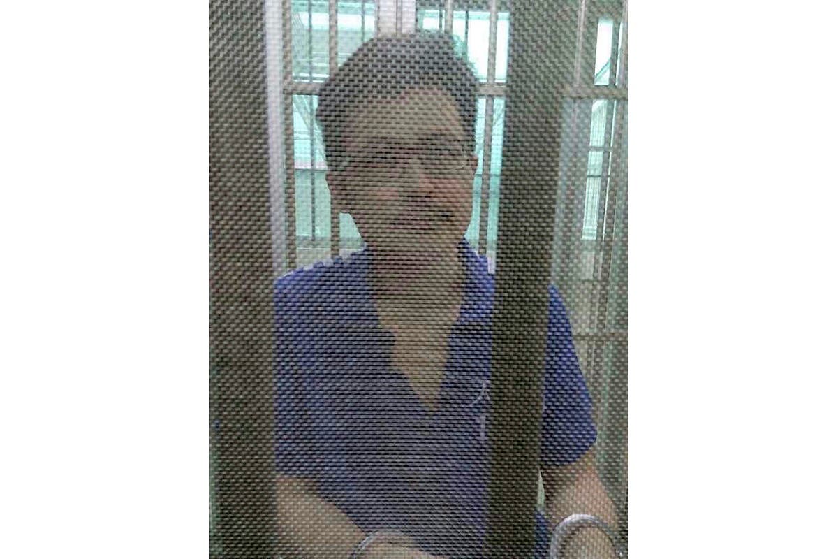 In this December 2014, file photo, Yang Maodong, better known by his penname Guo Feixiong, sits in a detention center in Guangzhou in southern China's Guangdong province. (AP)