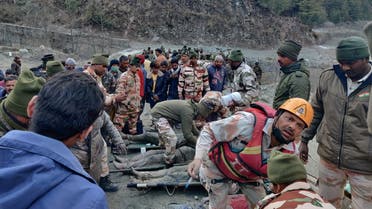 Members of Indo-Tibetan Border Police tend to people rescued after a Himalayan glacier broke and swept away a small hydroelectric dam, in Chormi. (Reuters)