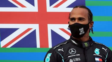 Mercedes' Lewis Hamilton celebrates on the podium after winning the Eifel Grand Prix, at Nurburg, Germany, on October 11, 2020. (Reuters)