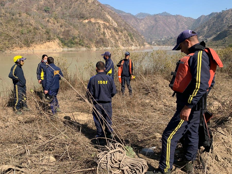  Rescuers prepare to search for bodies in the downstream of Alaknanda River in Rudraprayag, northern state of Uttarakhand, India, Monday, Feb.8, 2021. More than 2,000 members of the military, paramilitary groups and police have been taking part in search-and-rescue operations after part of a Himalayan glacier broke off Sunday and sent a wall of water and debris rushing down the mountain. (AP Photo/Rishabh R. Jain)