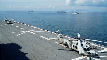 File photo two SH-60K anti-submarine helicopters on the flight deck of Japan’s Maritime Self Defense Force (JMSDF) helicopter carrier JS Izumo (DDH-183) in the foreground. (AP) 