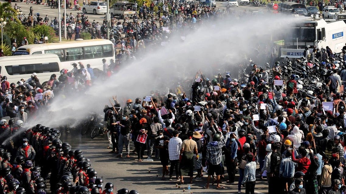 Police fire a water cannon at protesters demonstrating against the coup and demanding the release of elected leader Aung San Suu Kyi, in Naypyitaw, Myanmar, on February 8, 2021. (Reuters)