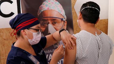 A volunteer receives an injection from a medical worker from Chinese pharmaceutical company CanSino Biologics Inc. for a late stage-trial against the coronavirus disease (COVID-19), in Oaxaca, Mexico November 6, 2020.(Reuters/Jorge Luis Plata)
