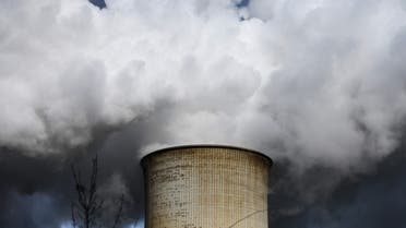 Steam rises from the cooling towers of the coal-fired power station of a factory. (AFP)