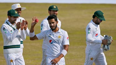 Pakistan’s Hasan Ali (center), is congratulated teammates, who took five wickets during the third day of the second cricket test match between Pakistan and South Africa at the Pindi Stadium in Rawalpindi, Pakistan, on February 6, 2021. (AP)