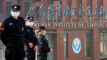 Security personnel keep watch outside Wuhan Institute of Virology during the visit by the WHO team tasked with investigating the origins of COVID-19, Feb. 3, 2021. (Reuters)