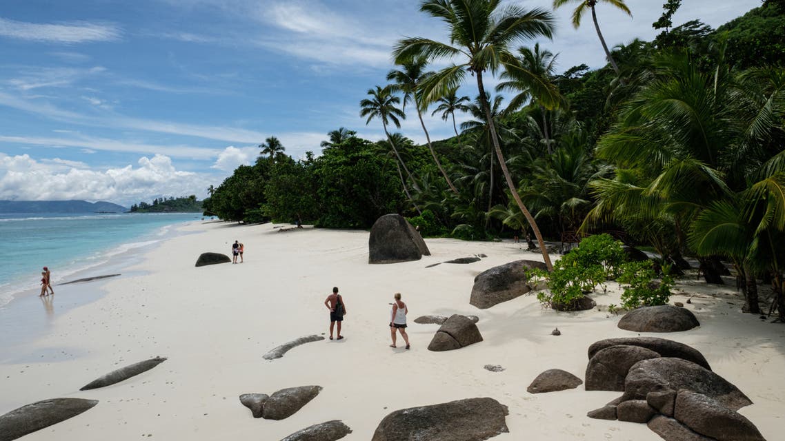 This file photo shows tourists walking on the beach on in Silhouette Island, Seychelles (File photo: AFP)