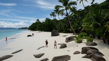 This file photo shows tourists walking on the beach  on in Silhouette Island, Seychelles (File photo: AFP)
