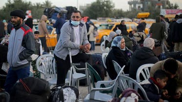 Palestinians wait to leave Rafah border crossing after it was opened by Egyptian authorities, in the southern Gaza Strip February 9, 2021. (Reuters/Ibraheem Abu Mustafa)