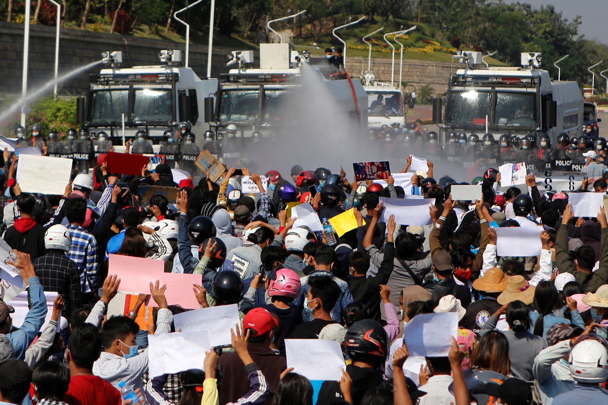 Police fire a water cannon at protesters rallying against the military coup and to demand the release of elected leader Aung San Suu Kyi, in Naypyitaw, Myanmar, February 9, 2021. (Reuters)