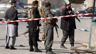 Afghan police officers stand guard at the site of an explosion in Kabul, Afghanistan, on February 6, 2021. (Reuters)