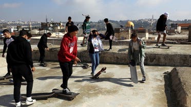 The Dome of the Rock located on the compound known to Muslims as Noble Sanctuary and to Jews as Temple Mount is seen in the background as Palestinian youths skateboard on rooftops, as Israel partially lifts its third national lockdown to fight the coronavirus disease (COVID-19) crisis, in Jerusalem's Old City February 7, 2021. (Reuters)