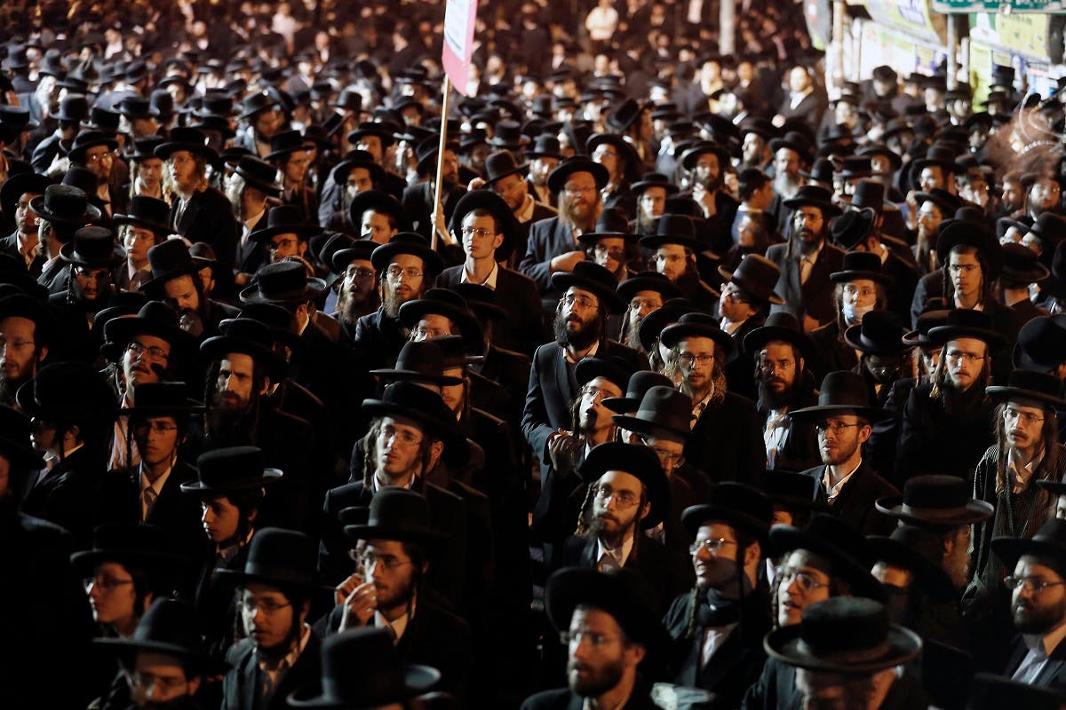 Ultra Orthodox Jews protest against the restrictions imposed by the Israeli government in Jerusalem's religious neighborhood of Mea Shearim, February 9, 2021. (Ahmad Gharabli /AFP)