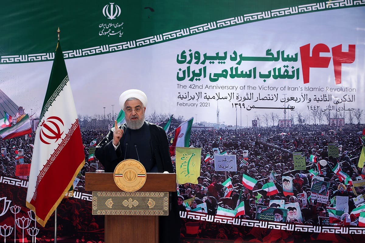 A handout picture provided by Iranian presidential office on February 10, 2021 shows Iranian President Hassan Rouhani speaking in Live TV speech marking the 42nd anniversary of the 1979 Islamic Revolution, in Tehran. (AFP)