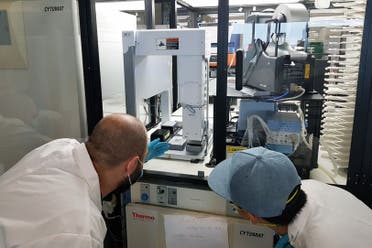 Researchers working on a new protocol for a more sensitive and accurate COVID-19 test at NYUAD. (NYUAD)