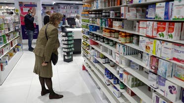 Customers browse the aisles for medicine at a pharmacy in Beirut, on Feb. 2, 2021. (AFP)