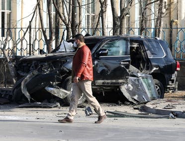 An Afghan security official inspects the site of a bomb blast in Kabul, Afghanistan,on February 9, 2021. (Reuters)