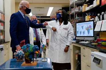 President Joe Biden greets Kizzmekia Corbett, an immunologist with the Vaccine Research Center at the National Institutes of Health (NIH), Feb. 11, 2021. (AP)