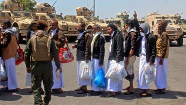 Yemeni prisoners who were held by the Huthi rebels greet officials at the airport in the southern city of Aden, the interim seat of the Yemeni government, on October 16, 2020, as the war-torn country began swapping 1,000 prisoners in a complex operation overseen by the International Committee of the Red Cross. Over 170 former prisoners of war were freed today on the second day of a landmark exchange between war-torn Yemen's government and Huthi rebels, the International Committee of the Red Cross said. A plane from the southern city of Aden, the interim seat of the Yemeni government, took 101 former prisoners to the rebel-held capital Sanaa on Friday, while another aircraft transported 76 detainees in the opposite direction, the ICRC said on Twitter.