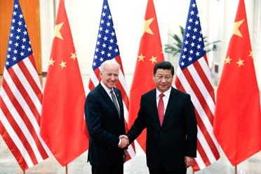  In this file photo taken on December 04, 2013 Chinese President Xi Jinping (R) shakes hands with US Vice President Joe Biden (L) inside the Great Hall of the People in Beijing.  President Biden expressed concerns to Chinese leader Xi Jinping about human rights in Hong Kong and Xinjiang late February 10, 2021, in their first call since Biden took office on January 20, according to the White House.