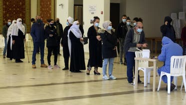 People wait in line to get tested for the coronavirus disease (COVID-19) in the town of Hasbaya, Lebanon, January 16, 2021. (Reuters/Aziz Taher)