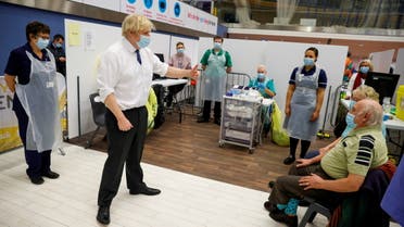 Britain's Prime Minister Boris Johnson visits a vaccination centre in Derby Arena, amidst the coronavirus disease (COVID-19) outbreak, in Derby, Britain February 8, 2021. REUTERS/Phil Noble/Pool REFILE - CORRECTING LOCATION