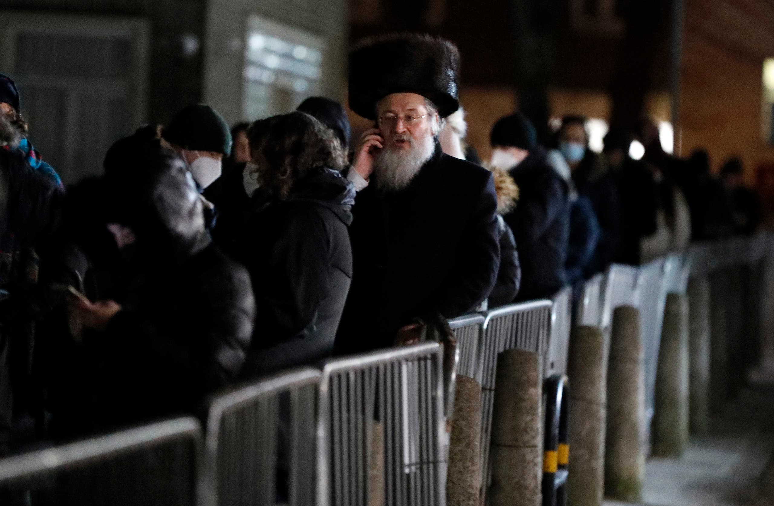  People from the Haredi Orthodox Jewish community arrive at an event to encourage vaccine uptake in the ultra-Orthodox community at the John Scott Vaccination Centre in London, Saturday, February 13, 2021. (AP)