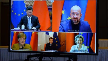 EU leaders and Chinese President Xi Jinping are seen on a screen during a video conference to approve an investment December 30, 2020 in Brussels, Belgium. (Johanna Geron/AFP)