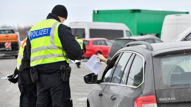 German border police officers check a car at the A17 motorway near the Czech-German border, after controls between Germany and the Czech Republic have been re-established, as the spread ofthe coronavirus disease (COVID-19) continues, in Breitenau, Germany, on February 15, 2021. (Reuters)
