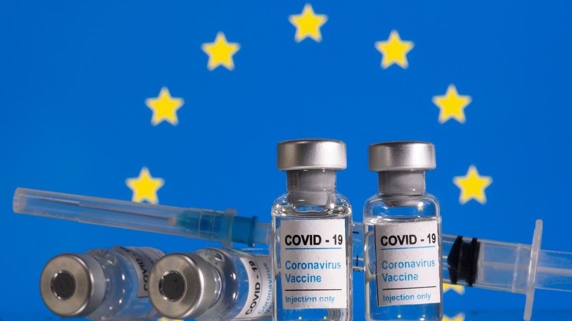 ials labelled COVID-19 Coronavirus Vaccine and sryinge are seen in front of displayed EU flag in this illustration taken, February 9, 2021. REUTERS