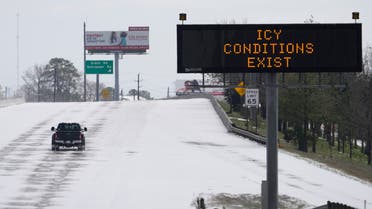 A truck drives past a highway sign Monday, Feb. 15, 2021, in Houston. (AP)
