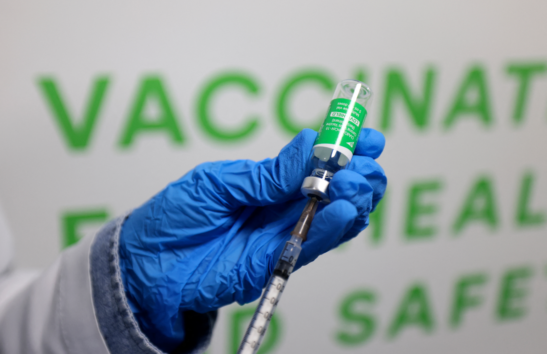A health worker prepares an injection of the Oxford–AstraZeneca vaccine (Covishield) against the coronavirus at a vaccination centre set up at the Dubai International Financial Center in the Gulf emirate of Dubai, on February 3, 2021. (AFP)