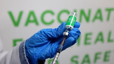 A health worker prepares an injection of the Oxford–AstraZeneca vaccine (Covishield) against the coronavirus at a vaccination centre set up at the Dubai International Financial Center in the Gulf emirate of Dubai, on February 3, 2021. (AFP)
