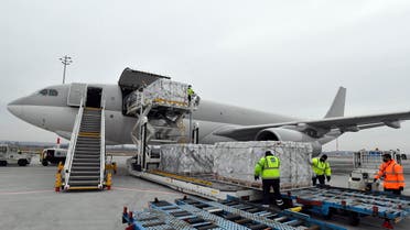 Boxes containing vaccines are unloaded from a Hungarian Airbus 330 cargo plane as the first batch of the vaccine against the new coronavirus produced by Sinopharm of China arrives at Budapest Liszt Ferenc International Airport in Budapest, Hungary, Tuesday, Feb. 16, 2021. (AP)