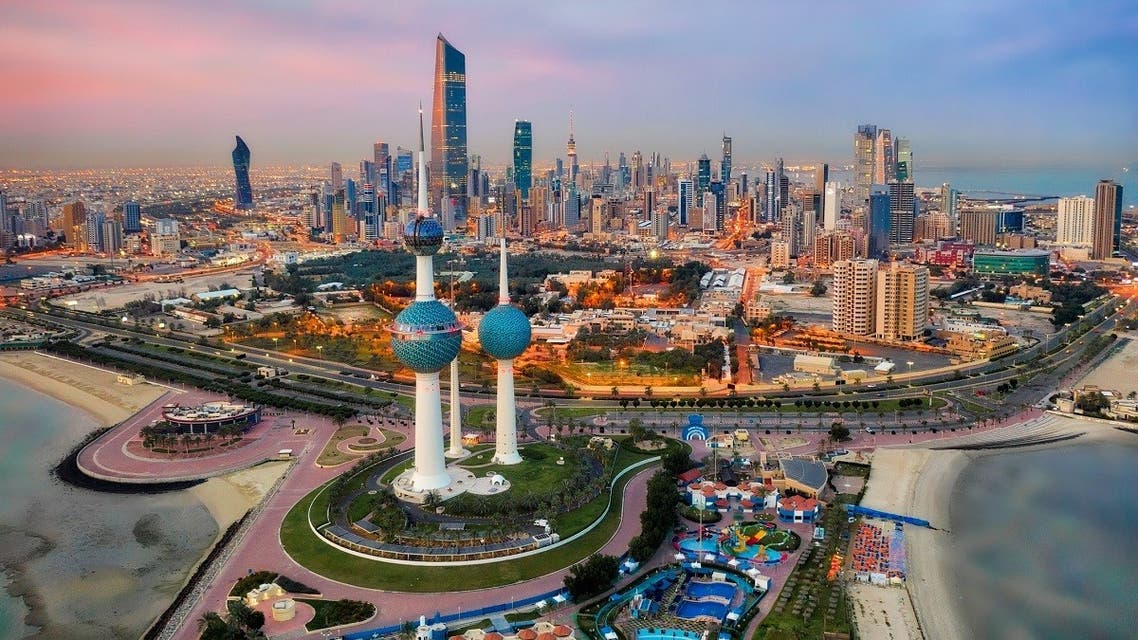 Kuwait Tower City Skyline glowing at night. (Lukas Bischoff via iStock)