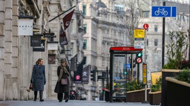  Two women walk down Regent Street, one of London's main shopping streets, as Britain continues its third COVID-19 lockdown, in London, Britain. (Reuters)