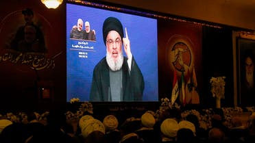 Hezbollah chief Hassan Nasrallah delivers a speech on a screen in the southern Lebanese city of Nabatieh, Jan 12, 2020. (AFP)