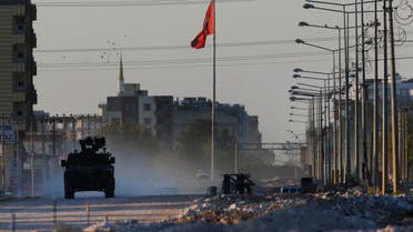 A Turkish police armored vehicle patrols the town of Akcakale, Sanliurfa province, southeastern Turkey, at the border with Syria, Saturday, Oct. 12, 2019. (AP)