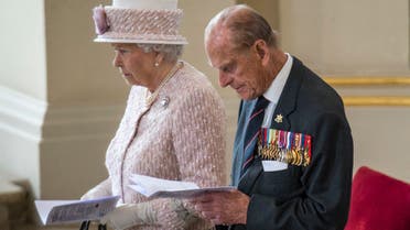 Britain's Prince Phillip, Duke of Edinburgh and Britain's Queen Elizabeth II attend a Service of Commemoration at St Martin-in-the-Fields church in central London on August 15, 2015, to mark the 70th anniversary of VJ (Victory over Japan) Day. (AFP)