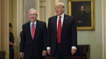 In this file photo taken on October 23, 2017 President Donald Trump (R) and Senate Majority Leader Mitch McConnell walk to a lunch on Capitol Hill. (Reuters) 