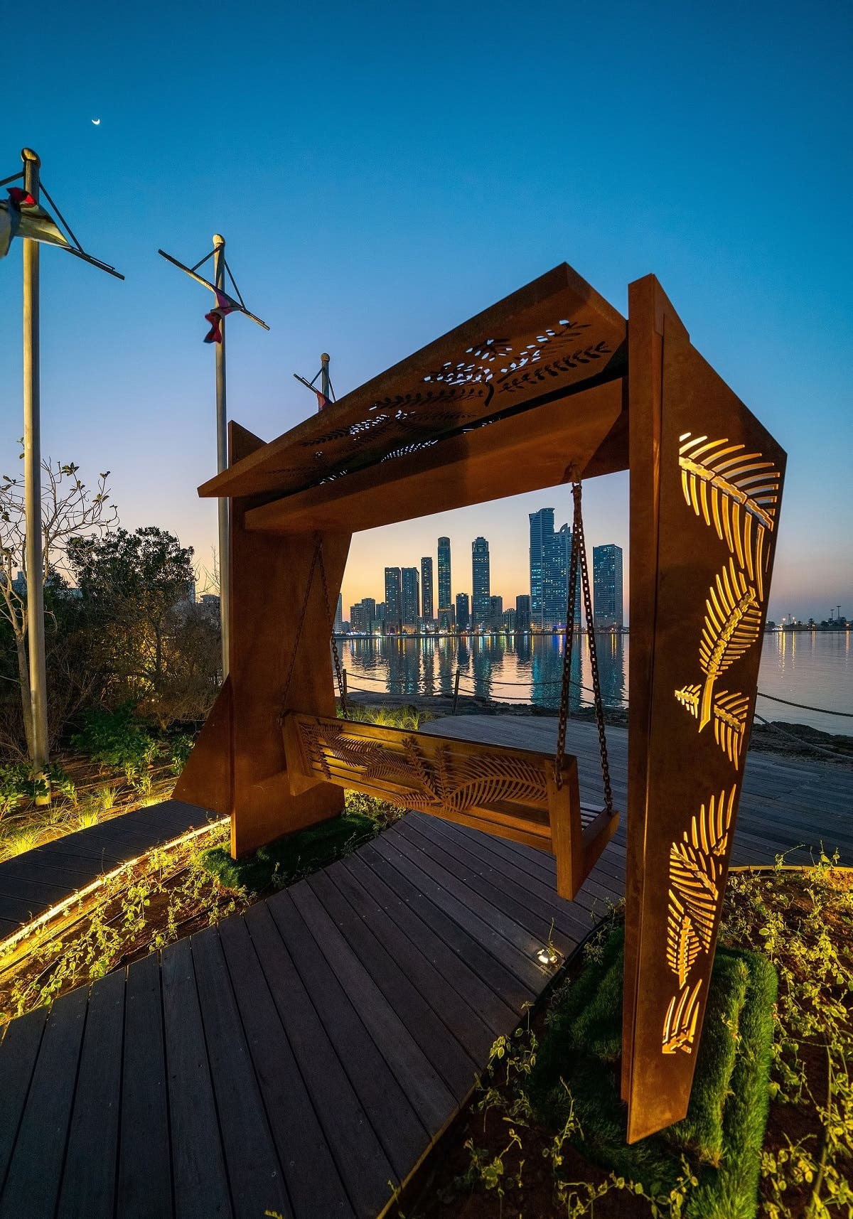 Shaped by seven abstract pieces of rusted mild steel and stainless steel, with Ghaf and palm tree leaves cut on them, ‘The Swing’ features immersive and sustainable art that reflects the past and the present of the UAE. (Supplied)