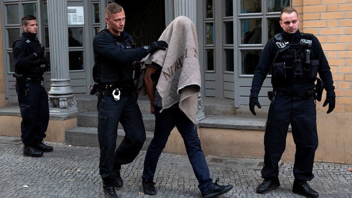 File photo of German special police escorting a person during a raid in Berlin, Germany. (Reuters)
