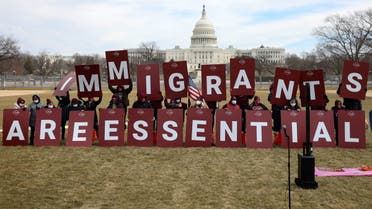 Demonstrators display a message along the National Mall during an immigrant essential workers rally near the U.S. Capitol in Washington, U.S., February 17, 2021. (Reuters)