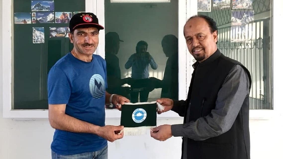 Pakistani mountaineer Mohammad Ali Sadpara (L) poses for a photo with a member of Alpine Club of Pakistan in Islamabad, Pakistan, in this undated photograph. (Reuters)