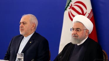 A handout picture provided by the Iranian presidency shows President Hassan Rouhani (R) and his top diplomat, Mohammad Javad Zarif, in Tehran on August 6, 2019. (AFP)