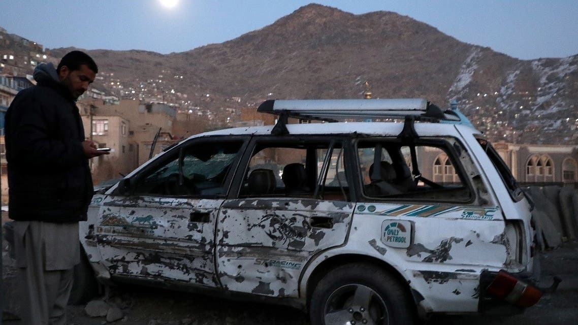 File photo of an Afghan man inspecting a damaged car after a bomb blast in Kabul, Afghanistan. (Reuters)