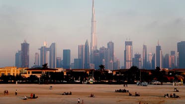 People enjoy the beach in front of the city skyline with the world tallest tower, Burj Khalifa, in Dubai, United Arab Emirates, Friday, Feb. 12, 2021. (File photo: AP)