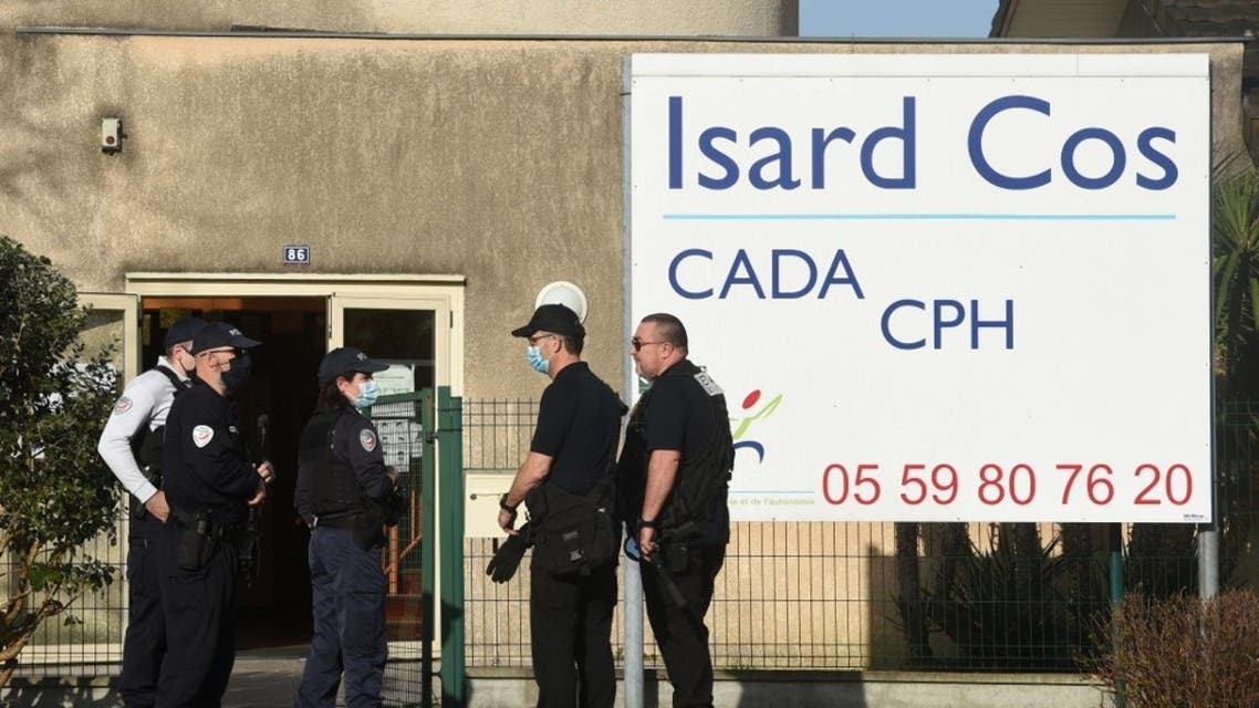 Police officers stand at the entrance of the Isard COS Reception Centre for Asylum Seekers (CADA) in Pau, where a manager has been stabbed to death by an asylum seeker in Pau, southwestern france, on February 19, 2021. (AFP)