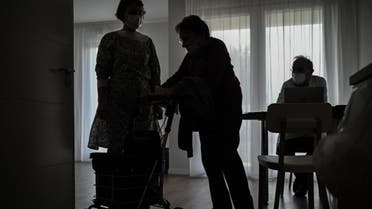 An elderly woman leaves after receiving an injection of a Covid-19 vaccine at a serviced residence for seniors at L'Isle-d'Espagnac on February 16, 2021. (AFP)